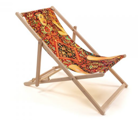 LADY ON CARPET DECK CHAIR